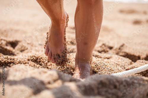 Zufuß auf dem Sand photo