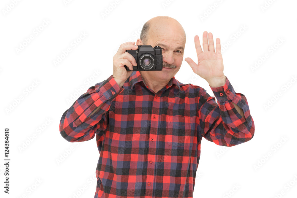 elderly man looks into the camera viewfinder elderly man looks into the camera viewfinder