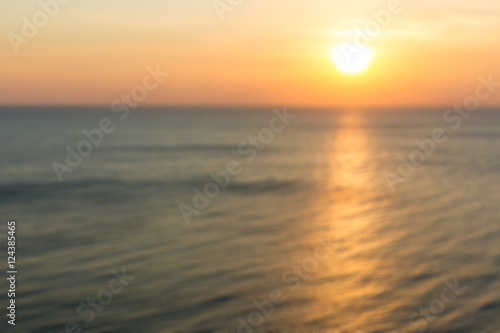 Blur image of ocean in sunset background. © DG PhotoStock