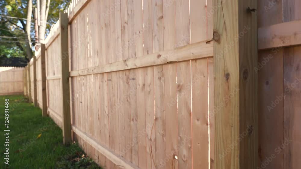Rising Up Side of New Fence in Backyard. shot moves slowly up the side of a new fence. From tip to the grass on corner of fence.
Rising Up Side of New Fence in Backyard. shot moves slowly up the side of a new fence. From tip to the grass on corner of fence.