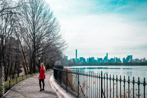 Girl walking near river at Central Park in Manhattan, New York C