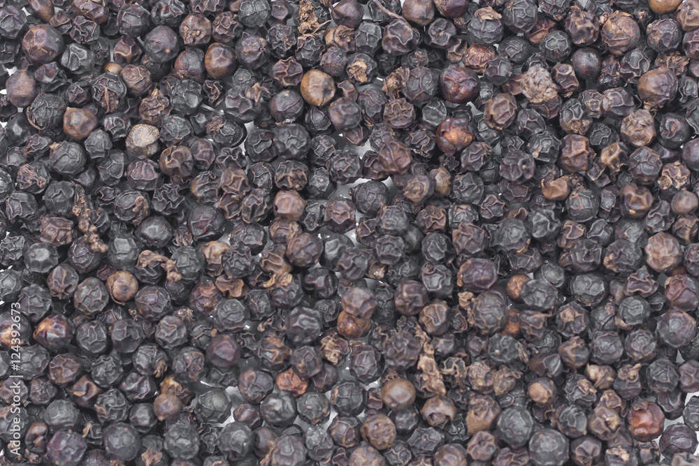 Black pepper grains as background Black pepper grains as background