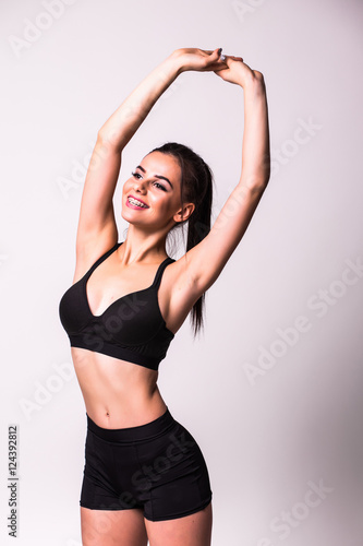 Portrait of Fitness girl on grey background © F8 \ Suport Ukraine