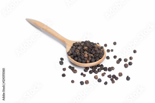 Black pepper in spoon wooden bowl isolated on white background