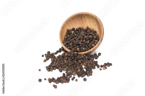 Black pepper in wooden bowl isolated on white background