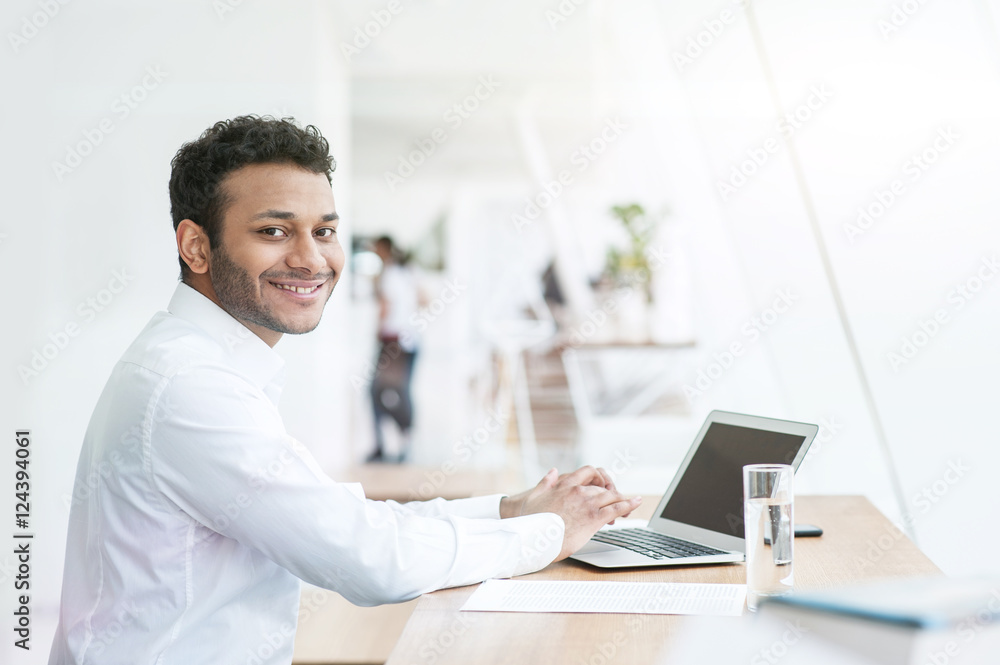 Attractive young man is working on a computer Attractive young man is working on a computer