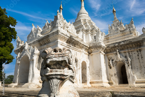White Pagoda at Inwa ancient city with lions guardian statues. Amazing architecture of old Buddhist Temples. Myanmar (Burma) travel landscapes and destinations © PerfectLazybones