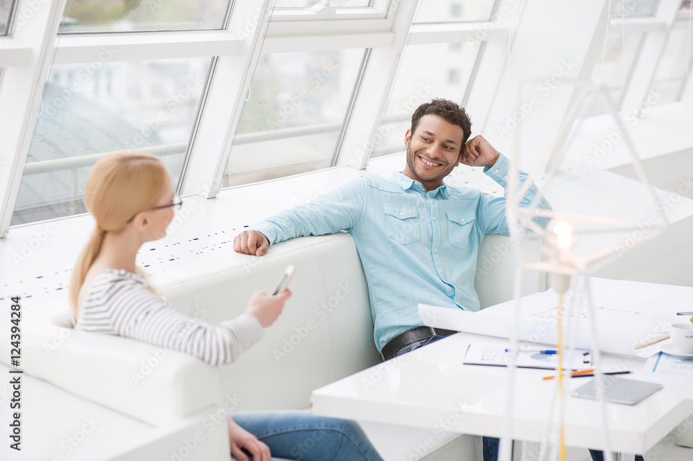 Fototapeta premium Young colleagues discussing job