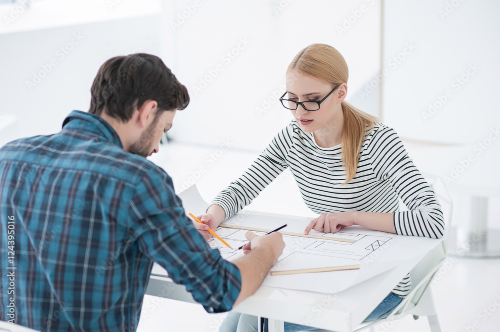 Obraz premium Two architects working together in office