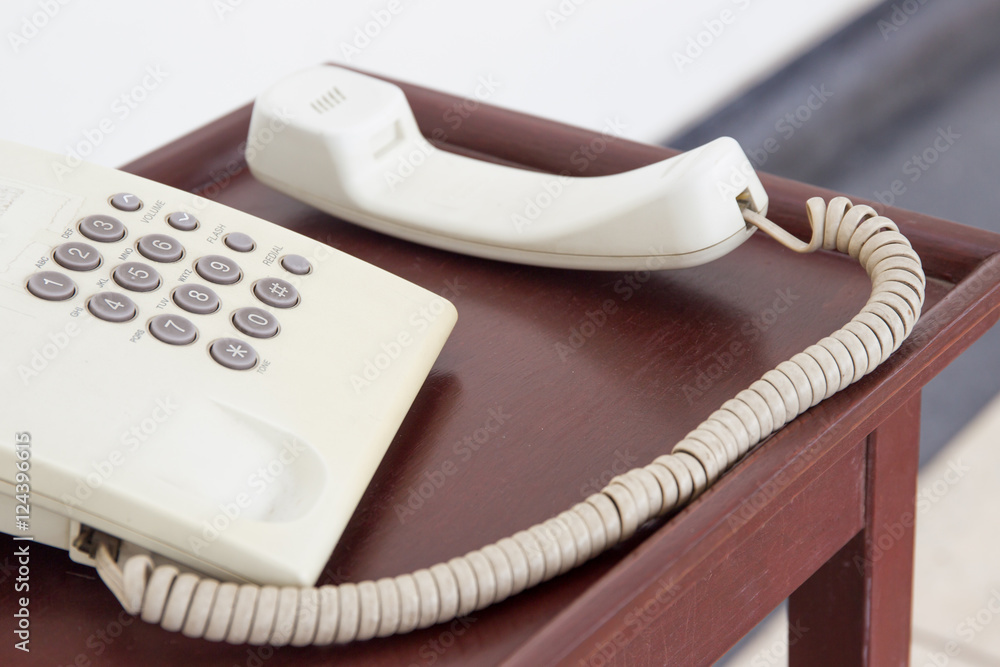 Old telephone on the wooden table close up. Old telephone on the wooden table close up.
