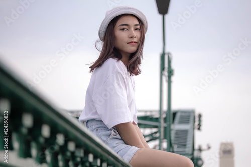 thai adult girl white T-shirt beautiful girl relax and smile photo