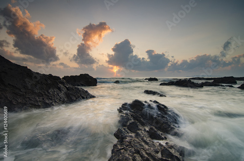 beautiful waves splashing on unique rocks formation at Pandak Be