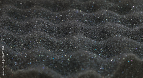 Texture of black sponge wave with glitter from speaker