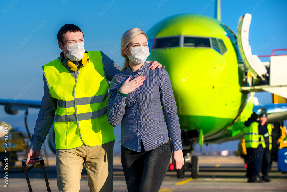 Sick passenger at an airport Sick passenger at an airport
