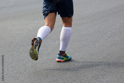 feet running athlete at the distance of a marathon