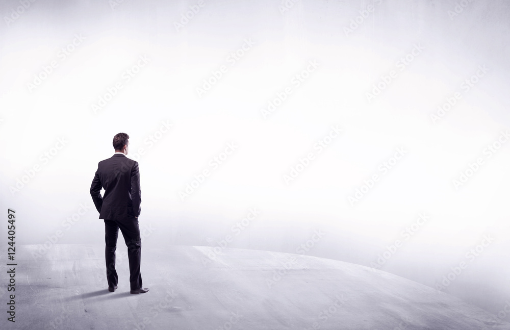 Business person standing from rear view Business person standing from rear view
