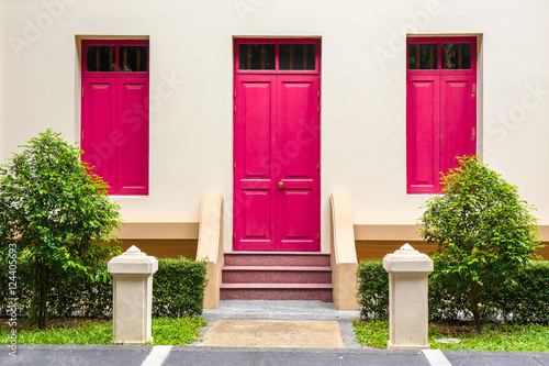 pink Door , pink window on Cream Wall on pink staircase with sma