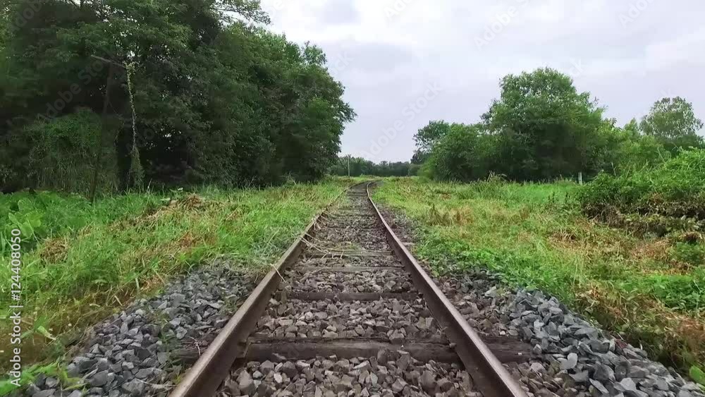 Walk along abandoned railway beside the forest in first person view Walk along abandoned railway beside the forest in first person view