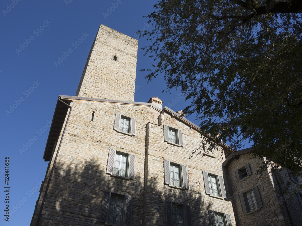 Bergamo - Old city (Citta Alta). One of the beautiful city in Italy. Lombardia. The old tower named Torre del Gombito. Landscape during a wonderful blu day