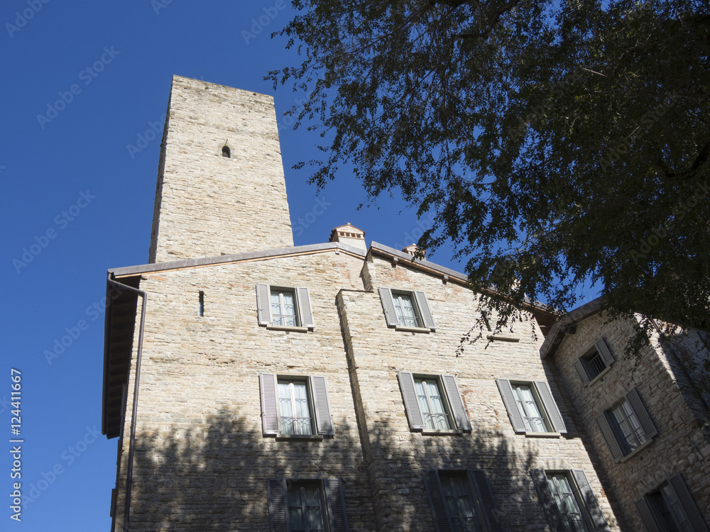 Bergamo - Old city (Citta Alta). One of the beautiful city in Italy. Lombardia. The old tower named Torre del Gombito. Landscape during a wonderful blu day