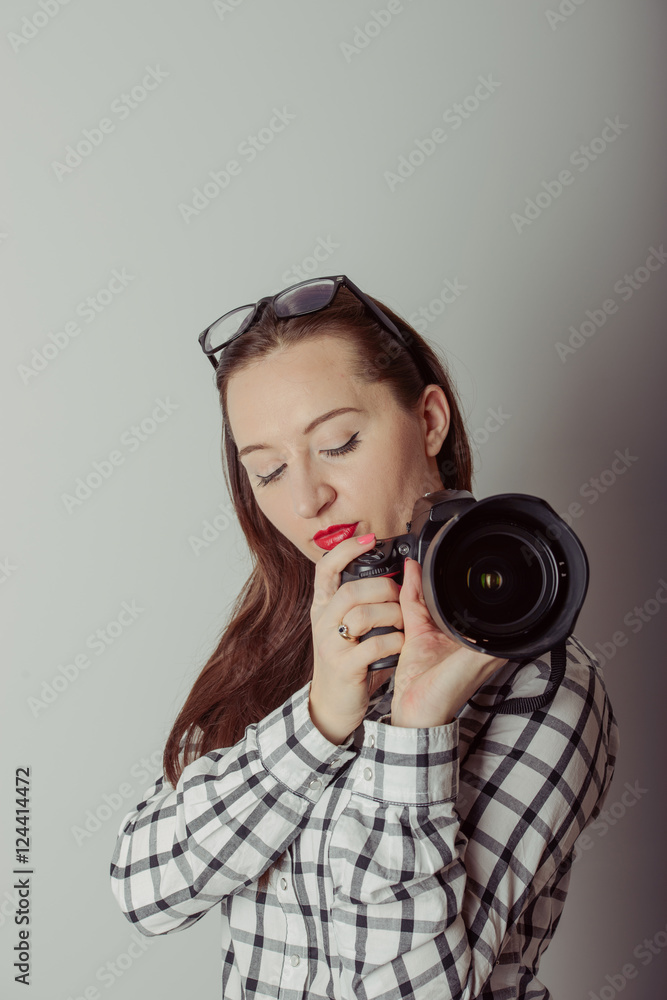 Fototapeta premium Woman-photographer takes images,