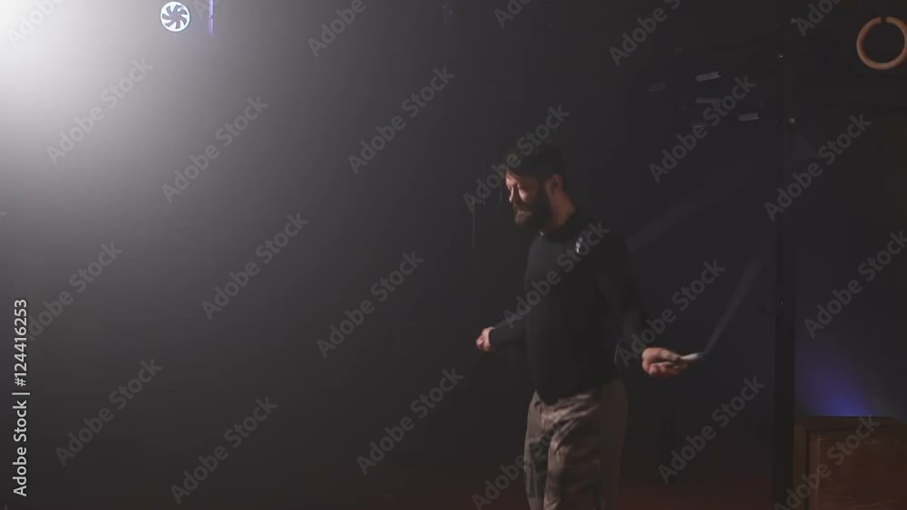 Athlete do exercise on a skipping rope.