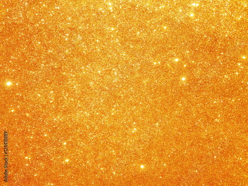 Christmas gold background. Golden holiday glowing glitter