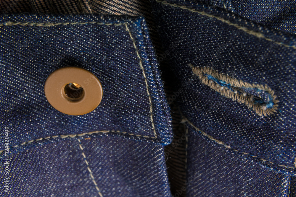 Close up of jeans fragment with open button. Denim texture. Close up of jeans fragment with open button. Denim texture.
