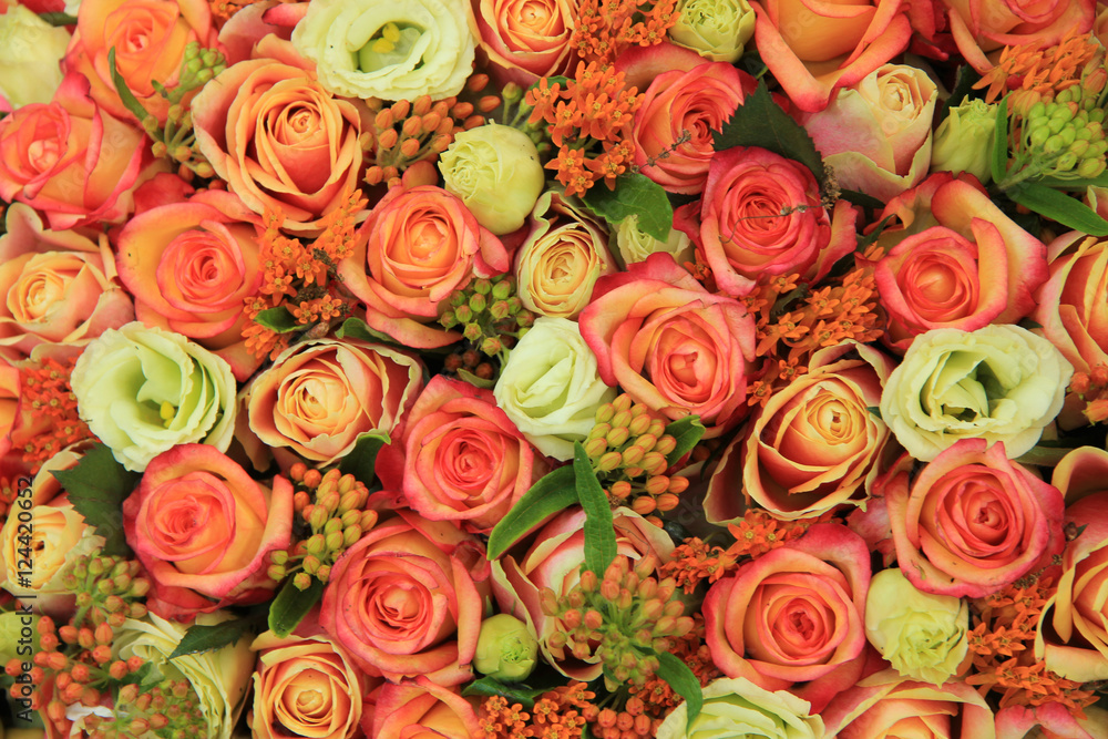 Orange and yellow roses in a bridal bouquet Orange and yellow roses in a bridal bouquet
