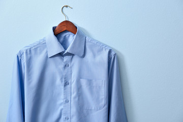 New male shirt on blue background