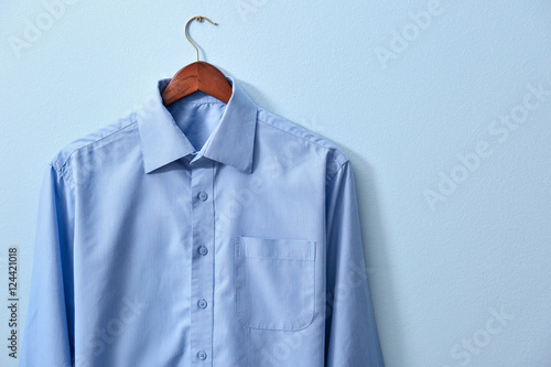 New male shirt on blue background