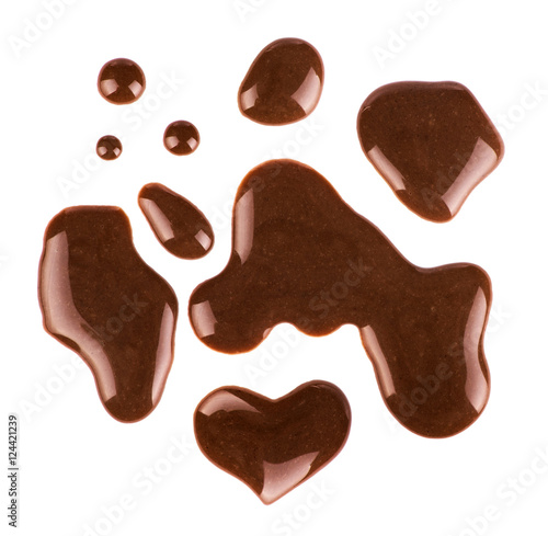 Set of multiple puddles of chocolate on white background