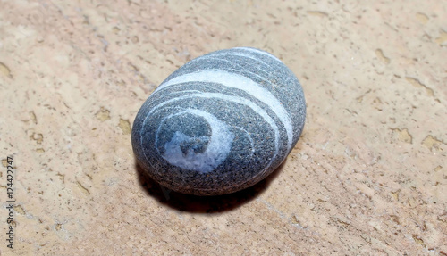 The stone with spiral image.