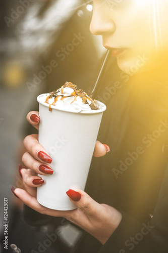 Drink in hand. Coffee, Latte. The sun's rays.