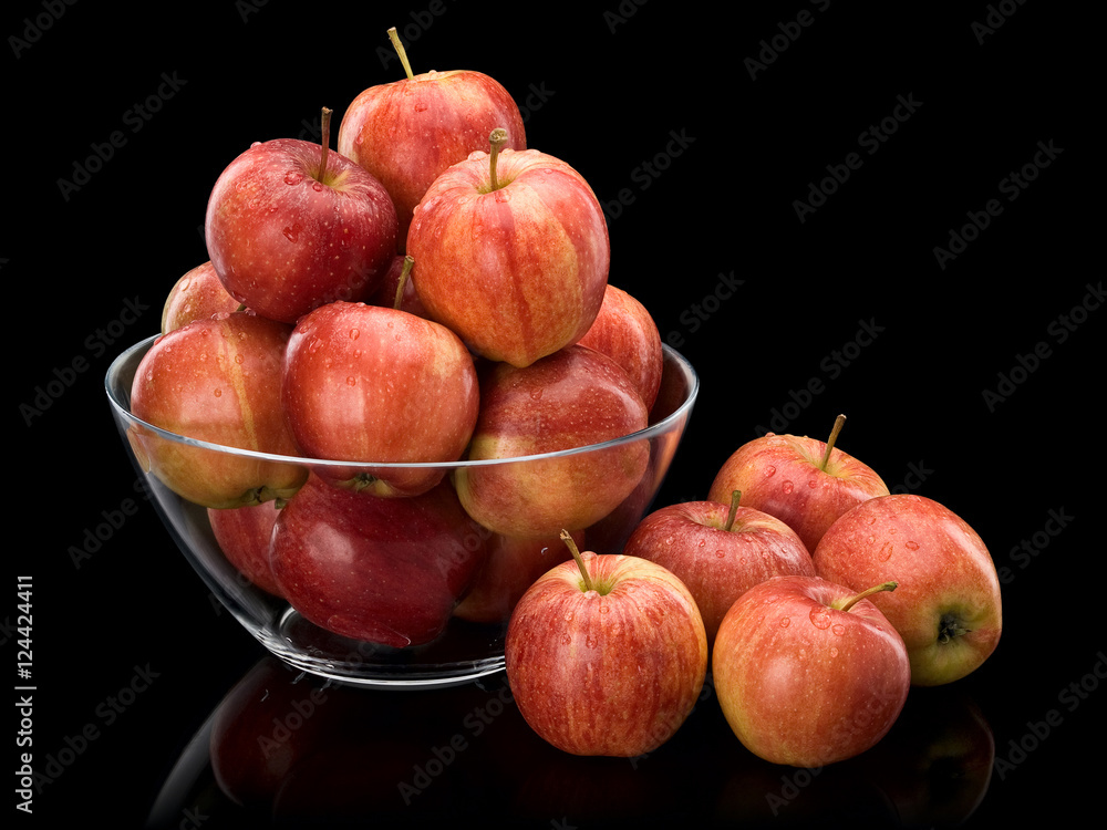 Crop of red apples in glass vase Crop of red apples in glass vase