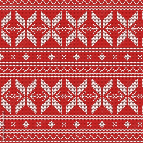 Winter seamless geometric ethnic knitwear pattern .