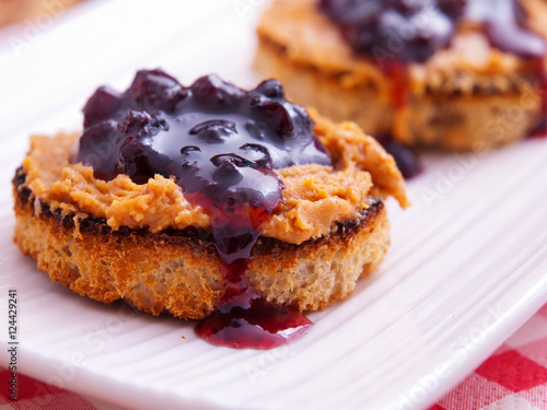 Toasts with peanut butter and cranberry jam. Horizontal shot