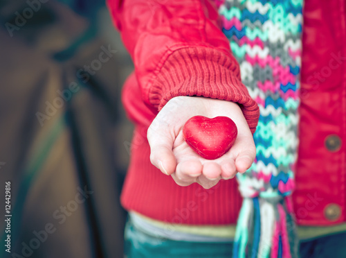 Heart shape love symbol in woman hands Valentines Day romantic greeting people relationship concept winter holiday