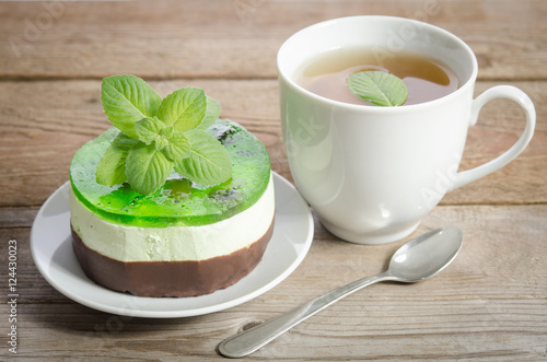 herbal tea with cake on wooden background. horizontal position
