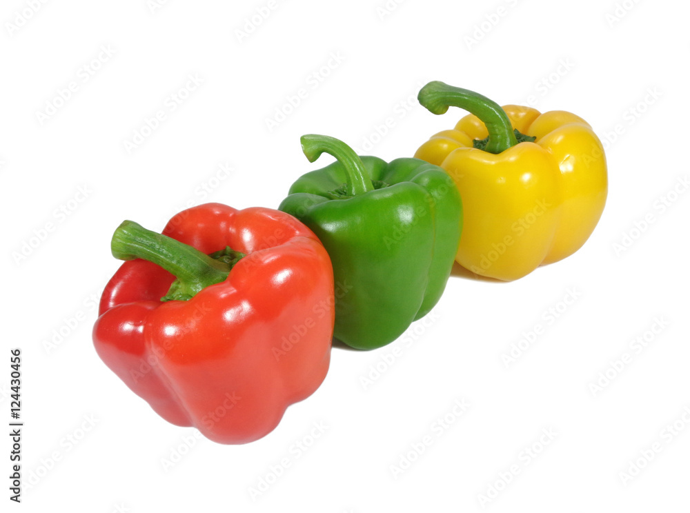 Three bright red, green, yellow ripe bell peppers with green stem isolated on white background Three bright red, green, yellow ripe bell peppers with green stem isolated on white background