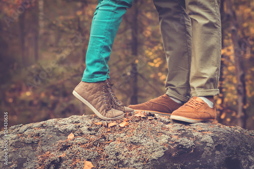 Couple Man and Woman Feet in Love Romantic Outdoor with Autumn season nature on background Fashion trendy style