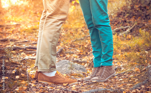 Couple Man and Woman Feet in Love Romantic Outdoor with Autumn season nature on background Fashion trendy style