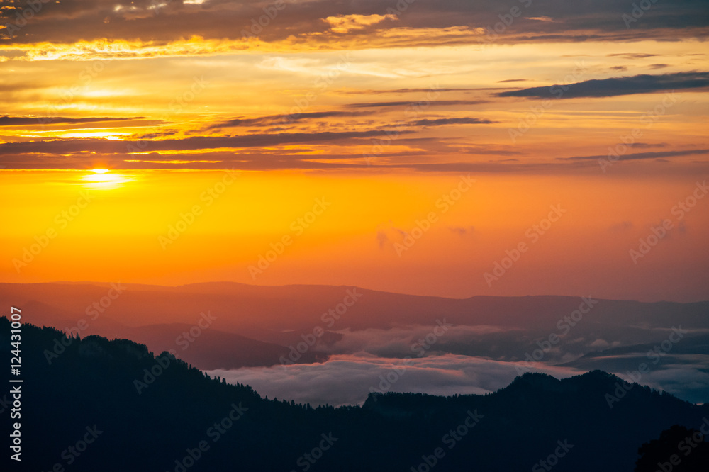 Background of Sunset Sky and Mountains clouds beautiful scenery with natural colors Landscape Travel concept aerial view Background of Sunset Sky and Mountains clouds beautiful scenery with natural colors Landscape Travel concept aerial view