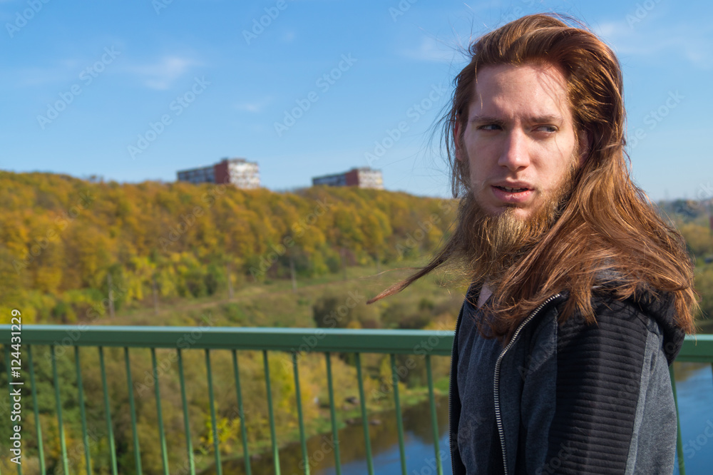 © Rob Rye - Portrait of man with a long beard and a long hair near the river © Rob Rye - Portrait of man with a long beard and a long hair near the river