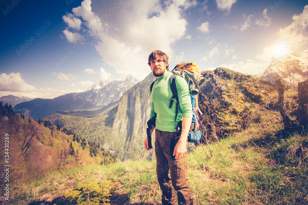 Young Man Traveler relaxing outdoor with mountains on background Summer vacations and Lifestyle hiking concept