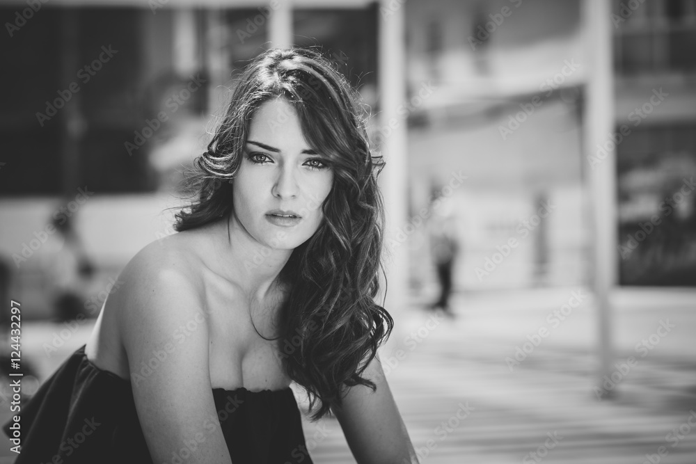 Beautiful young woman with blue eyes in urban background Beautiful young woman with blue eyes in urban background