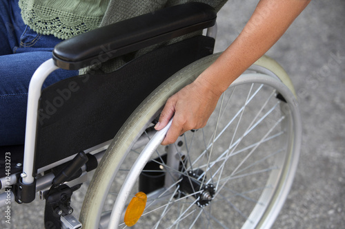 Tableau sur toile closeup of woman sitting in a wheelchair