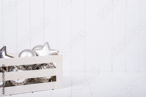 Christmas decoration over white striped background - selective focus, copy space