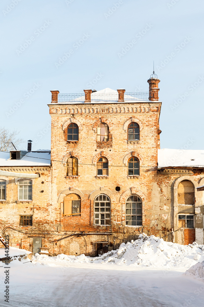 old red brick building in the winter in central Russia
