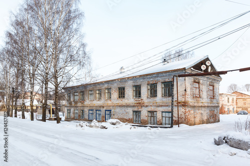 old red brick building in the winter in central Russia © miklyxa